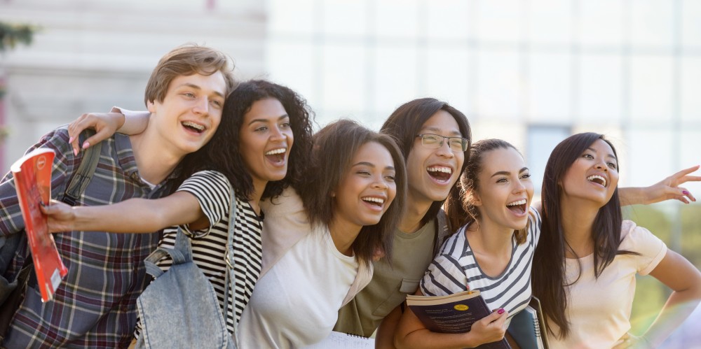 Canva - Multiethnic Group of Young Happy Students Standing Outdoors-1000x499.jpg